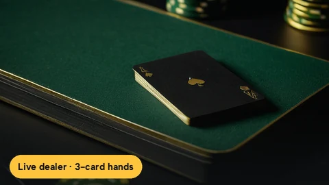 Three face-down playing cards on felt for a round of Teen Patti